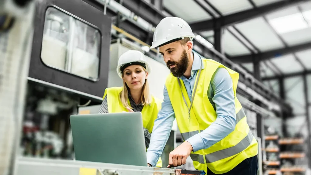 What Is Manufacturing? Unlocking Processes, Types & Value 4 A Portrait of an Industrial Man and Woman Engineer with Laptop in a Factory, Working. What Is Manufacturing Unlocking Processes, Types & Value ROSNOK